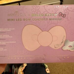 Brand new impressions vanity hello kitty LeD bow compact mirror